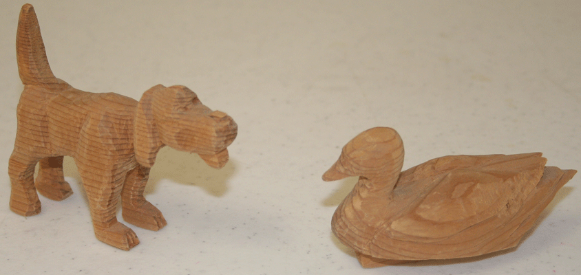 carved duck and dog