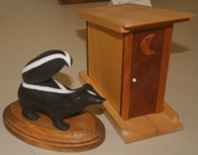 skunk and outhouse